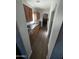 Long hallway with hardwood floors and access to other rooms at 7264 W Cielo Grande --, Peoria, AZ 85383