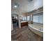 Bathroom with a large soaking tub, double vanity, and hardwood floors at 7264 W Cielo Grande --, Peoria, AZ 85383