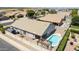 Aerial view showcasing home, pool, and surrounding neighborhood at 8762 E Posada Ave, Mesa, AZ 85212