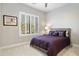 Serene bedroom with a comfortable bed, window shutters, and stylish decor at 37202 Ne Greythorn Cir, Carefree, AZ 85377