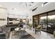 Open concept living room with high ceilings and a view of the kitchen at 37202 Ne Greythorn Cir, Carefree, AZ 85377