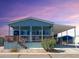 Single-wide manufactured home with covered carport and porch at 8600 E Broadway Rd # 154, Mesa, AZ 85208