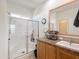 Clean bathroom with a walk-in shower and updated vanity at 8600 E Broadway Rd # 154, Mesa, AZ 85208