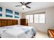 Comfortable bedroom with ceiling fan and window seating at 4901 S Calle Los Cerros Dr # 267, Tempe, AZ 85282