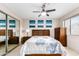 Bright bedroom with a ceiling fan, large window, and dresser at 4901 S Calle Los Cerros Dr # 267, Tempe, AZ 85282