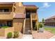 Condo building entry with stairs and landscaping at 4901 S Calle Los Cerros Dr # 267, Tempe, AZ 85282