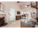 Living room with fireplace and view of kitchen and spiral staircase at 4901 S Calle Los Cerros Dr # 267, Tempe, AZ 85282