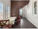 Bright breakfast nook with brick accent wall and wood floors at 819 S 3Rd Ave, Phoenix, AZ 85003