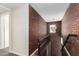 Brick wall staircase with metal railing and chandelier at 819 S 3Rd Ave, Phoenix, AZ 85003