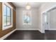 Bright dining room with hardwood floors and an adjacent entryway at 819 S 3Rd Ave, Phoenix, AZ 85003