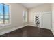 Bright bedroom with dark wood floors and access to bathroom at 819 S 3Rd Ave, Phoenix, AZ 85003