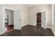 Open living room with dark brown laminate floors and views into kitchen at 819 S 3Rd Ave, Phoenix, AZ 85003