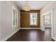 Elegant dining room featuring hardwood floors and a statement chandelier at 819 S 3Rd Ave, Phoenix, AZ 85003