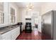 Kitchen with white cabinets, dark countertops, and stainless steel appliances at 819 S 3Rd Ave, Phoenix, AZ 85003