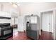 Kitchen features stainless steel appliances and red tile floor at 819 S 3Rd Ave, Phoenix, AZ 85003