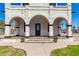 Home's exterior features a charming porch with arched entryways at 819 S 3Rd Ave, Phoenix, AZ 85003