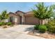 Single-story home with desert landscaping and a two-car garage at 11227 W Bloch Rd, Tolleson, AZ 85353