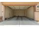 Empty garage with open door, offering ample storage space at 11227 W Bloch Rd, Tolleson, AZ 85353