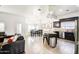 Spacious kitchen with island, dark cabinetry, and tile flooring at 772 N Swan Dr, Gilbert, AZ 85234