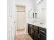 Clean bathroom with double vanity and large mirrors at 772 N Swan Dr, Gilbert, AZ 85234