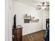 Spacious bedroom with a bunk bed and wall-mounted shelves at 772 N Swan Dr, Gilbert, AZ 85234