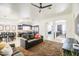 Open living room features a large area rug and comfy couch, adjacent to kitchen and dining area at 772 N Swan Dr, Gilbert, AZ 85234