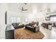Open living room with plush sofas and access to backyard at 772 N Swan Dr, Gilbert, AZ 85234