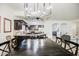 Kitchen features dark cabinets, a large island, and a chandelier at 772 N Swan Dr, Gilbert, AZ 85234