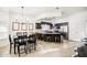 Eat-in kitchen with dark cabinets, island, and chandelier at 772 N Swan Dr, Gilbert, AZ 85234