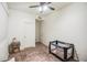 Well-lit bedroom with a crib and plenty of floor space at 772 N Swan Dr, Gilbert, AZ 85234