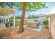 Spacious backyard with hot tub, covered patio, and grassy area at 772 N Swan Dr, Gilbert, AZ 85234