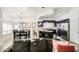 Open concept kitchen with island, dark cabinets and dining area at 772 N Swan Dr, Gilbert, AZ 85234