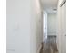 Clean hallway with light walls and wood-look flooring at 7413 E Taylor St, Scottsdale, AZ 85257