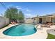 Inviting kidney-shaped pool with lounge chairs at 7413 E Taylor St, Scottsdale, AZ 85257