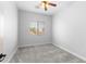 Bright bedroom with carpeted floor and ceiling fan at 16205 W Berkeley Rd, Goodyear, AZ 85395