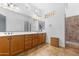 Primary bathroom with double vanity and large mirror at 16205 W Berkeley Rd, Goodyear, AZ 85395
