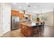 Bright kitchen features an island, stainless steel appliances, and lots of cabinet space at 16205 W Berkeley Rd, Goodyear, AZ 85395