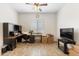 Home office with built-in desk and plenty of natural light at 16205 W Berkeley Rd, Goodyear, AZ 85395