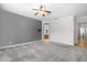 Large main bedroom with grey accent wall and ceiling fan at 16205 W Berkeley Rd, Goodyear, AZ 85395