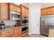 Modern kitchen with double ovens, stainless steel refrigerator, and ample counter space at 16205 W Berkeley Rd, Goodyear, AZ 85395