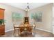 Charming dining area with wood table and chairs, near the kitchen at 16205 W Berkeley Rd, Goodyear, AZ 85395