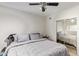 Spacious bedroom with a queen-size bed and mirrored closet at 351 E Thomas Rd # D108, Phoenix, AZ 85012