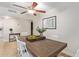 Dining area with a rustic wooden table and white chairs at 351 E Thomas Rd # D108, Phoenix, AZ 85012