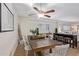 Dining area featuring a rustic wood table and white chairs at 351 E Thomas Rd # D108, Phoenix, AZ 85012