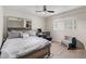 Bedroom with a queen bed, workspace, and ceiling fan at 351 E Thomas Rd # D108, Phoenix, AZ 85012