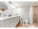 Updated bathroom with double vanity, shower, and tile flooring at 351 E Thomas Rd # D108, Phoenix, AZ 85012