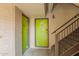 Building entrance with green doors and stairs at 351 E Thomas Rd # D108, Phoenix, AZ 85012
