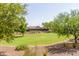 Landscaped green space with mature trees at 16245 W Culver St, Goodyear, AZ 85338