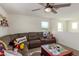 Relaxing loft with sectional sofa and a ceiling fan at 16245 W Culver St, Goodyear, AZ 85338