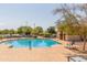 Relaxing community pool with plenty of lounge chairs at 16245 W Culver St, Goodyear, AZ 85338